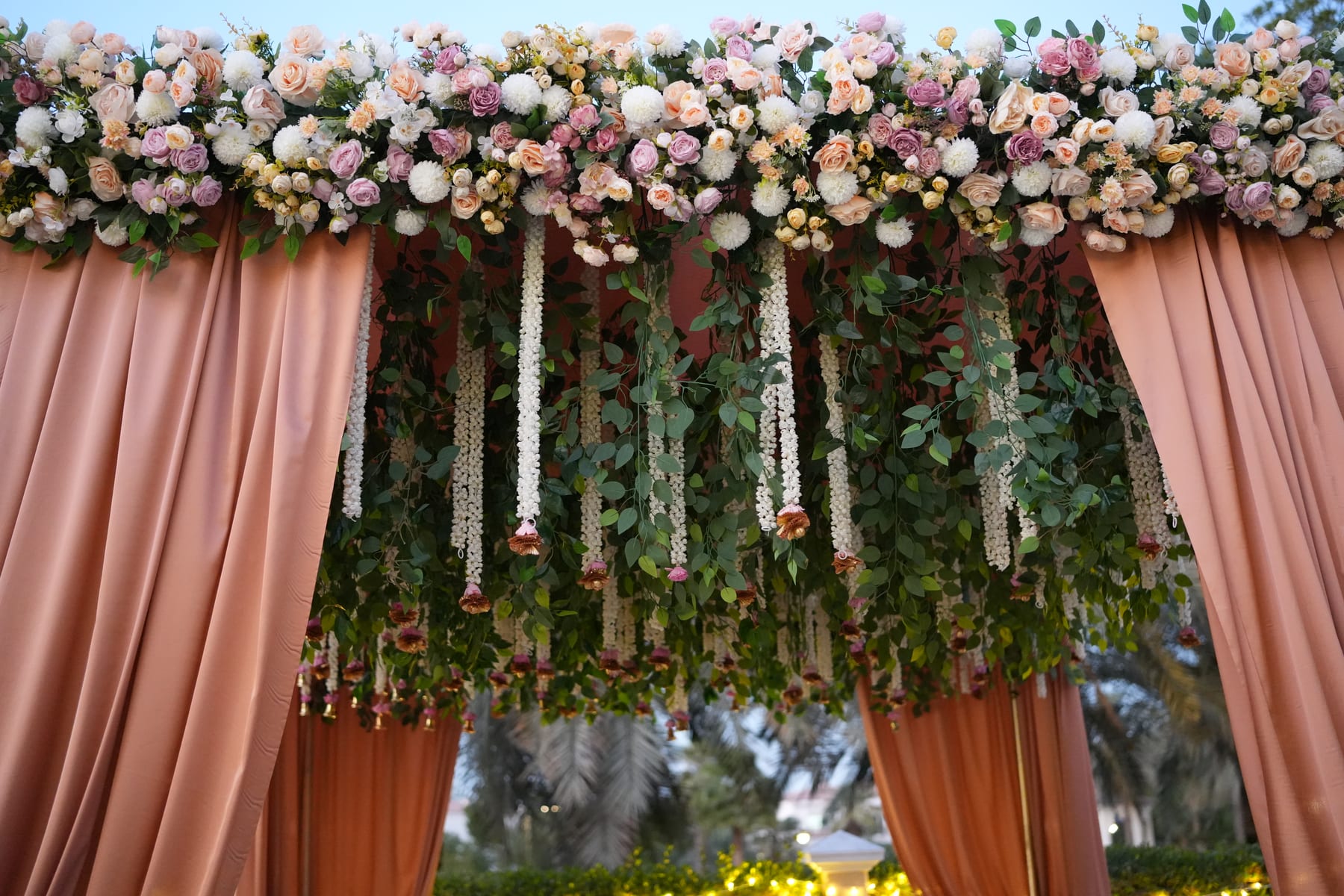 Hanging floral canopy of roses and jasmine garlands