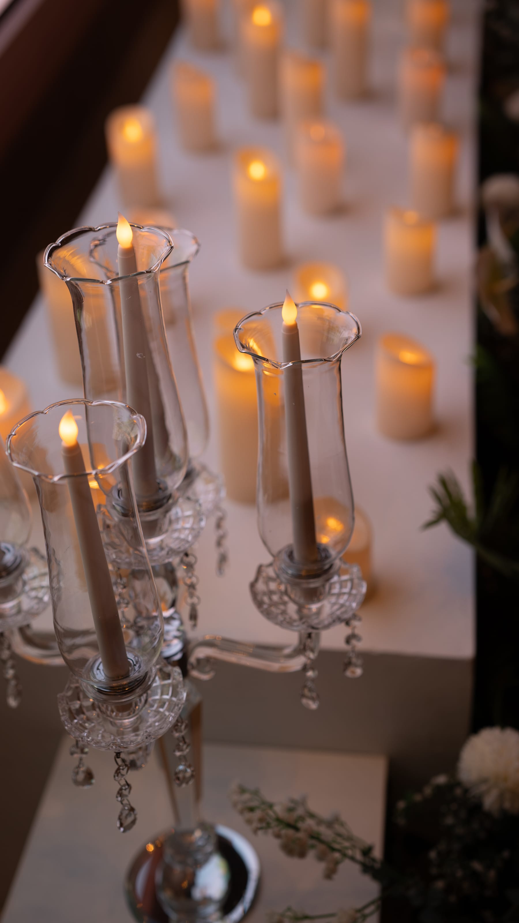 Candlelit tablescape with warm reception lighting