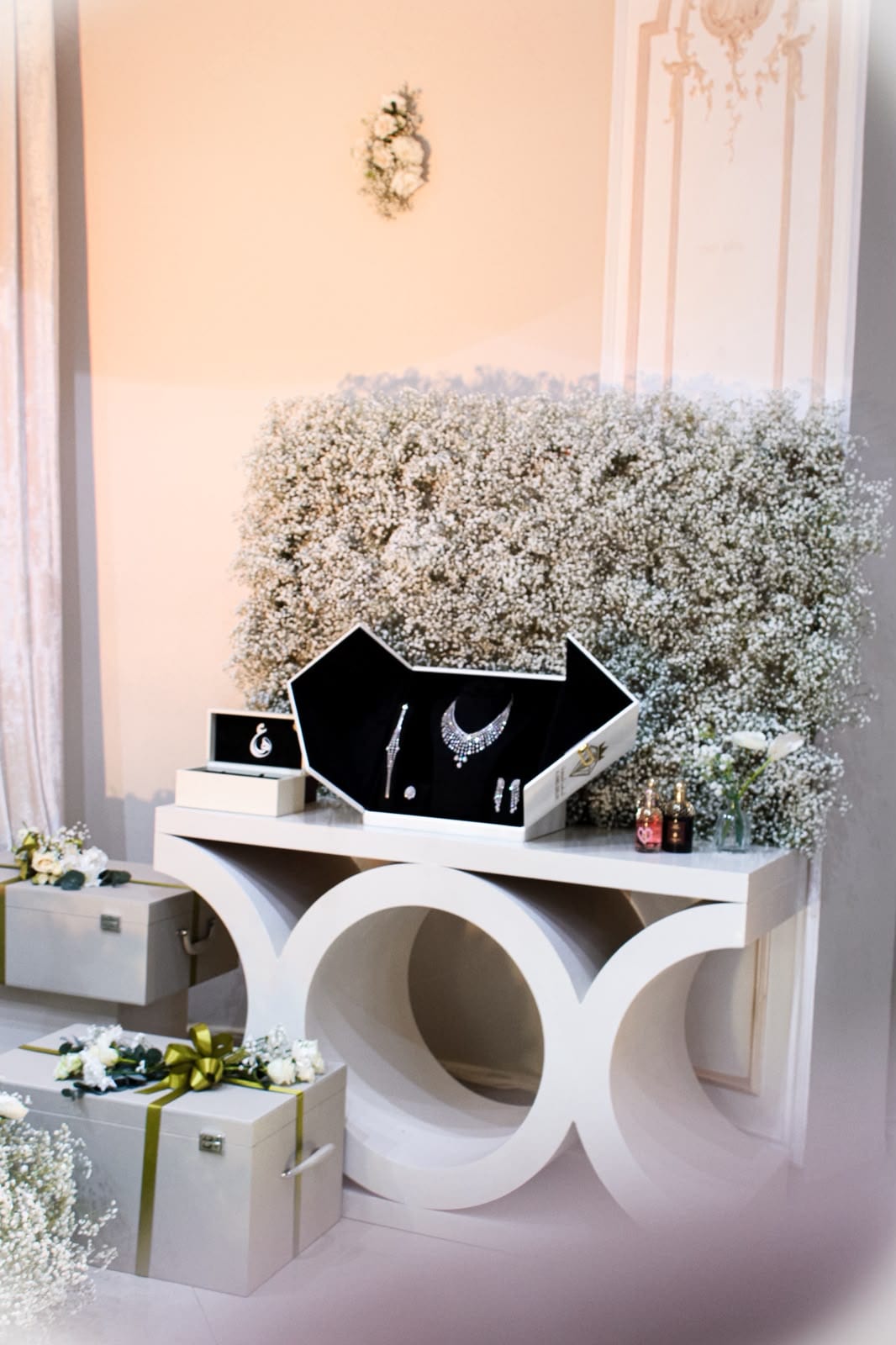 Styled console with flowers and a directional sign