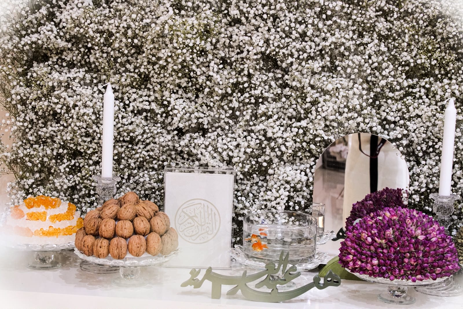 Purple and white florals on a white console