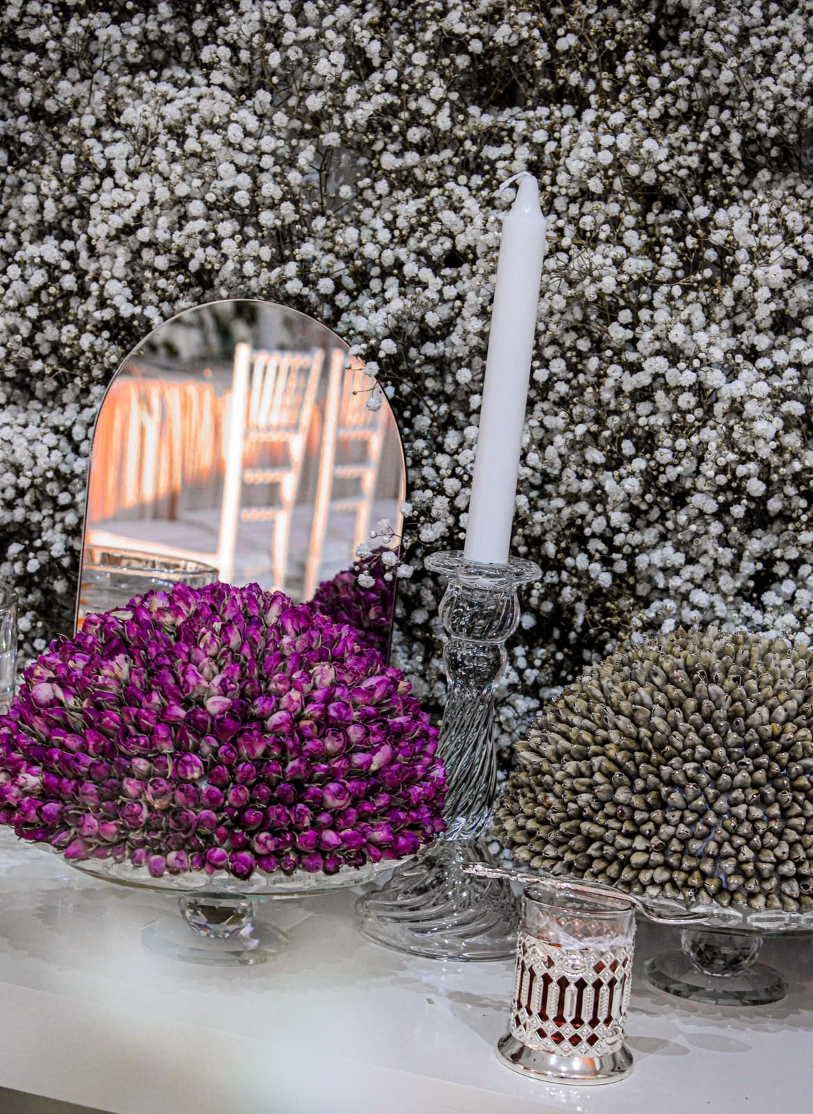Arched mirror framed with white flowers